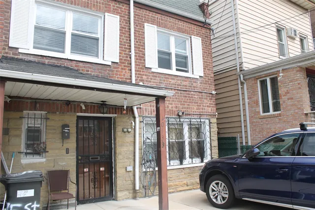 a front view of a house with parking space