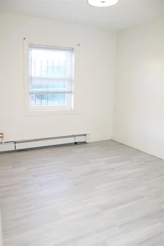 a kitchen with stainless steel appliances granite countertop a refrigerator a sink dishwasher a stove with white cabinets