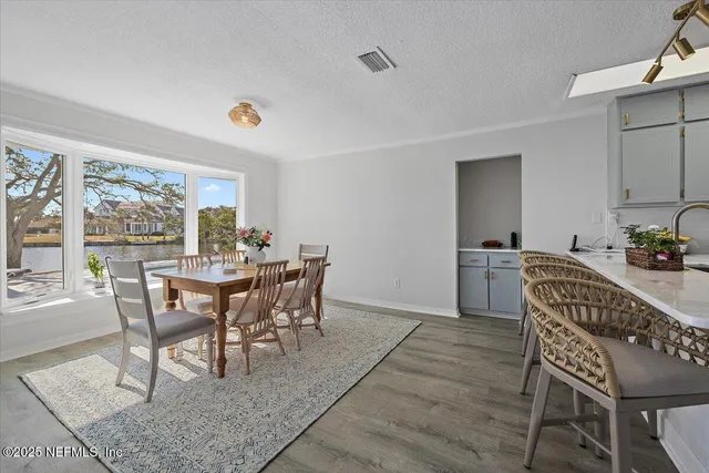 a view of a dining room with furniture window and outside view