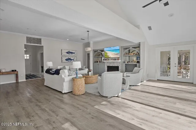 a living room with furniture and a table