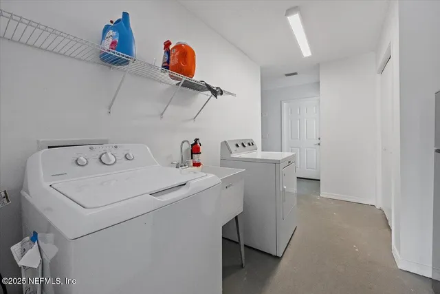 a utility room with dryer and washer