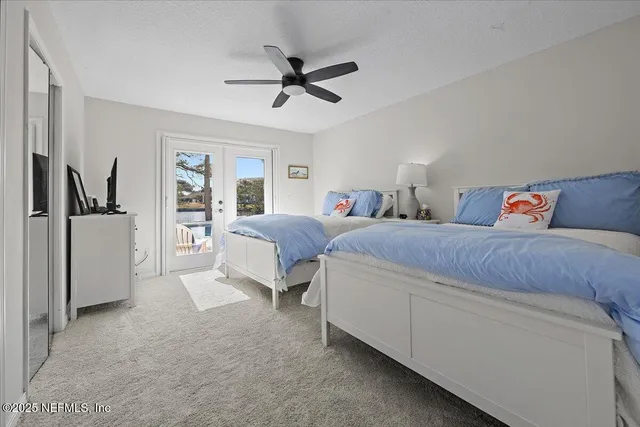 a living room with furniture and a ceiling fan