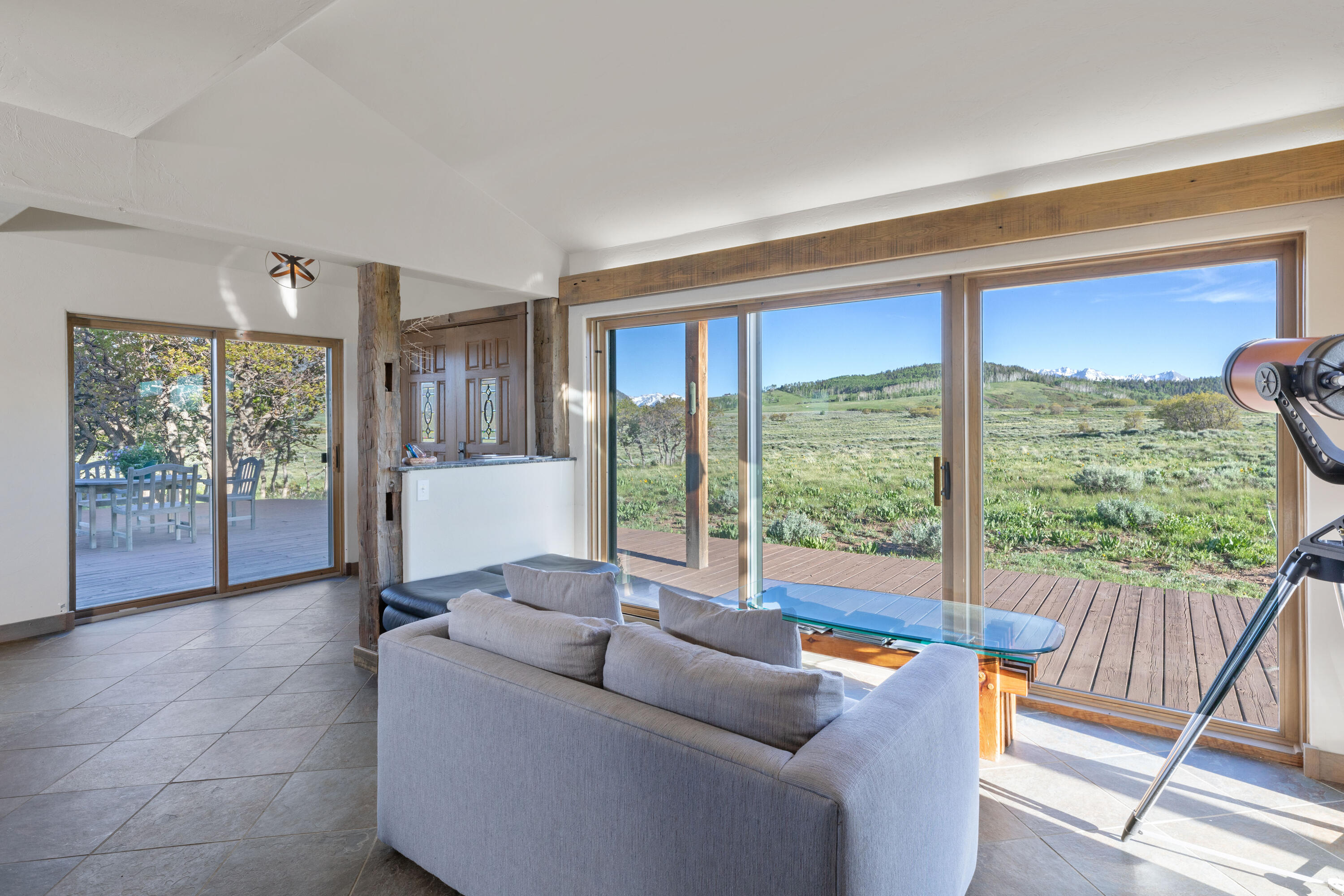 541 Elam Ridge Drive Placerville, CO 81430 - Photo 10 of 36 a living room with furniture and a large window