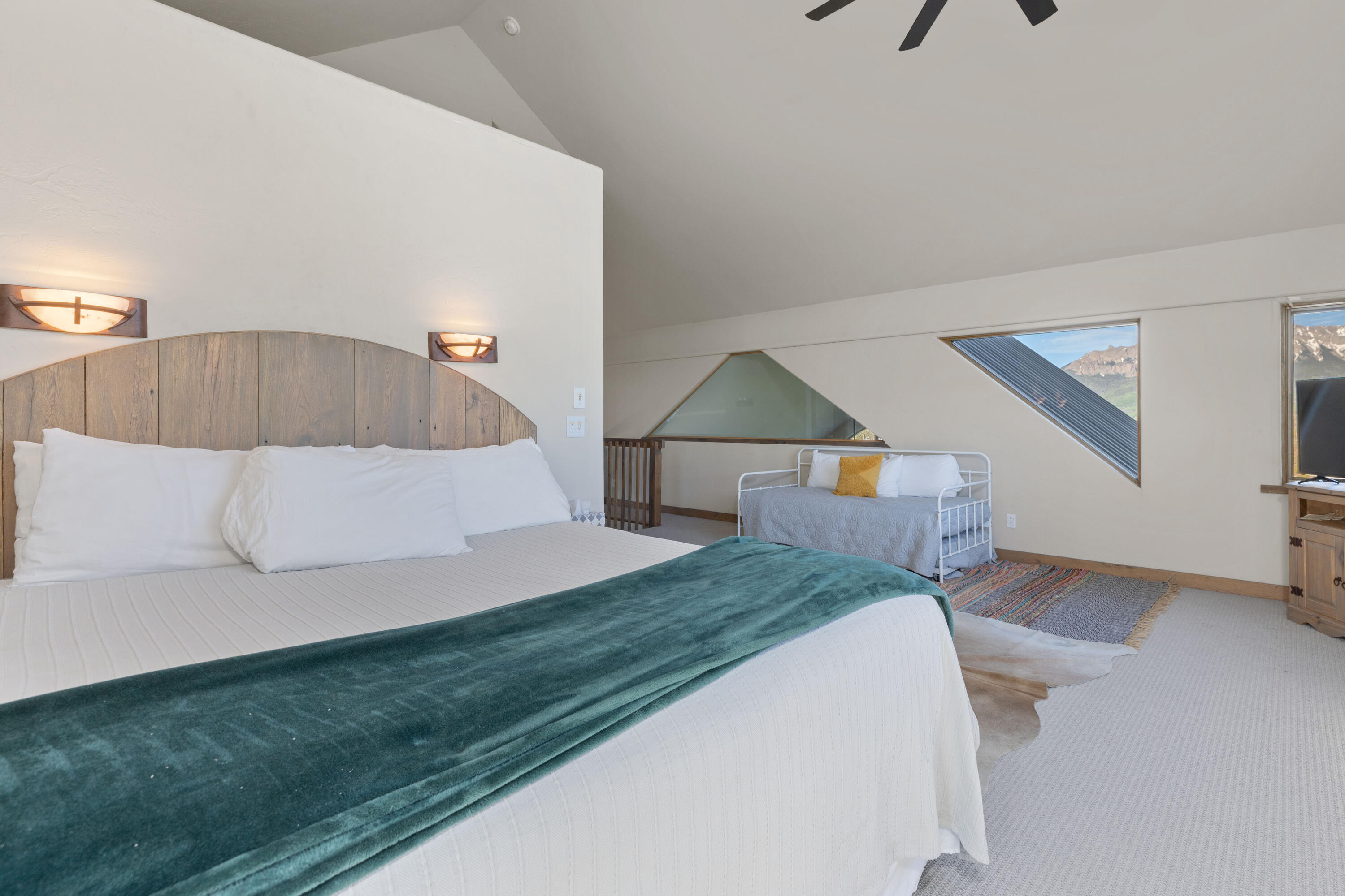 541 Elam Ridge Drive Placerville, CO 81430 - Photo 19 of 36 a bedroom with a bed and a night stand