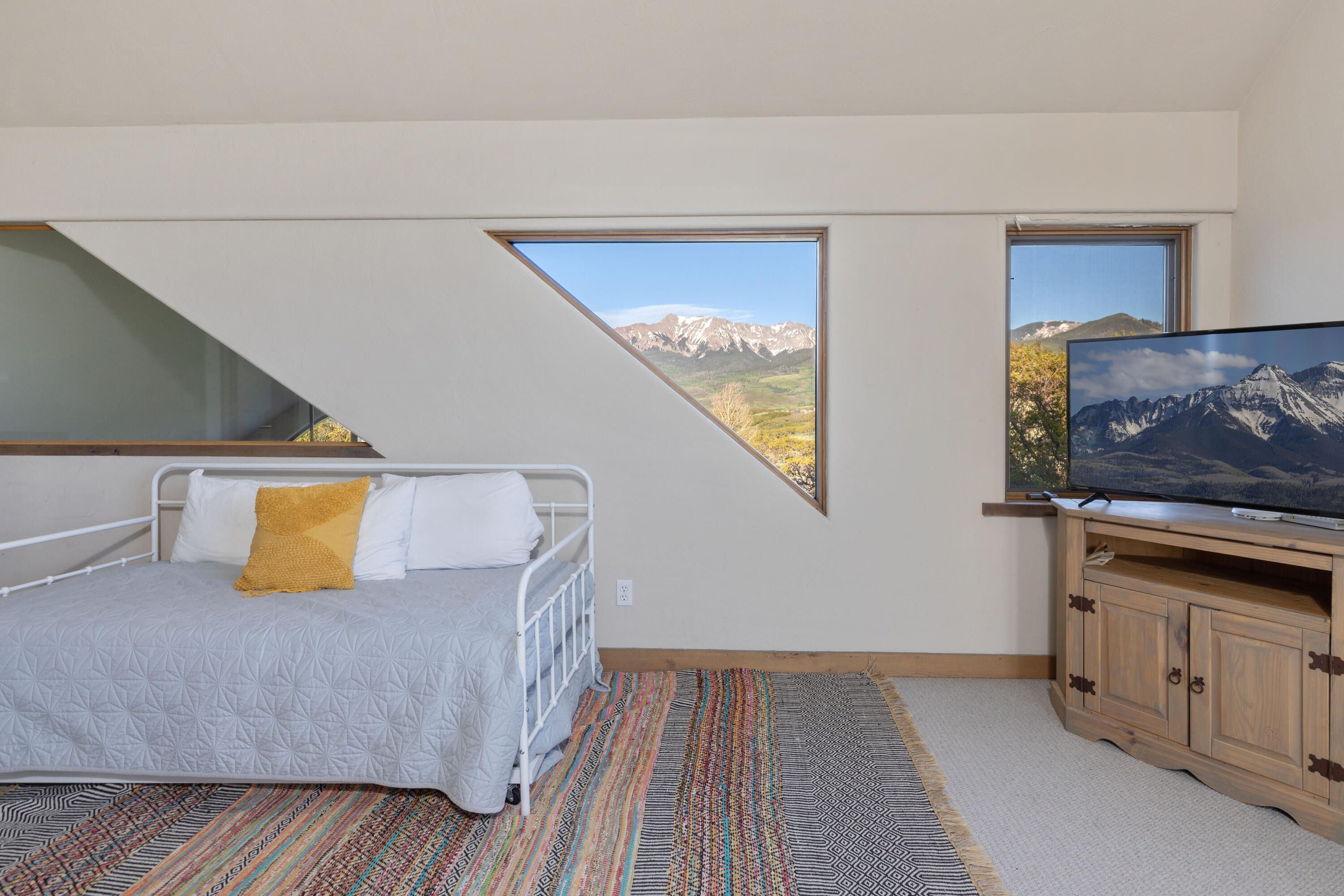 541 Elam Ridge Drive Placerville, CO 81430 - Photo 20 of 36 a living room with furniture and painting on the wall