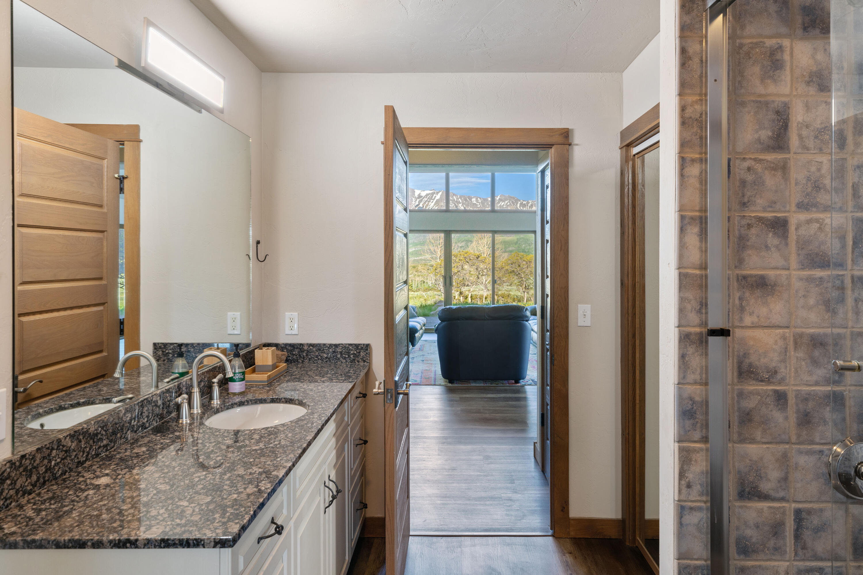 541 Elam Ridge Drive Placerville, CO 81430 - Photo 24 of 36 a kitchen with granite countertop a sink and a refrigerator