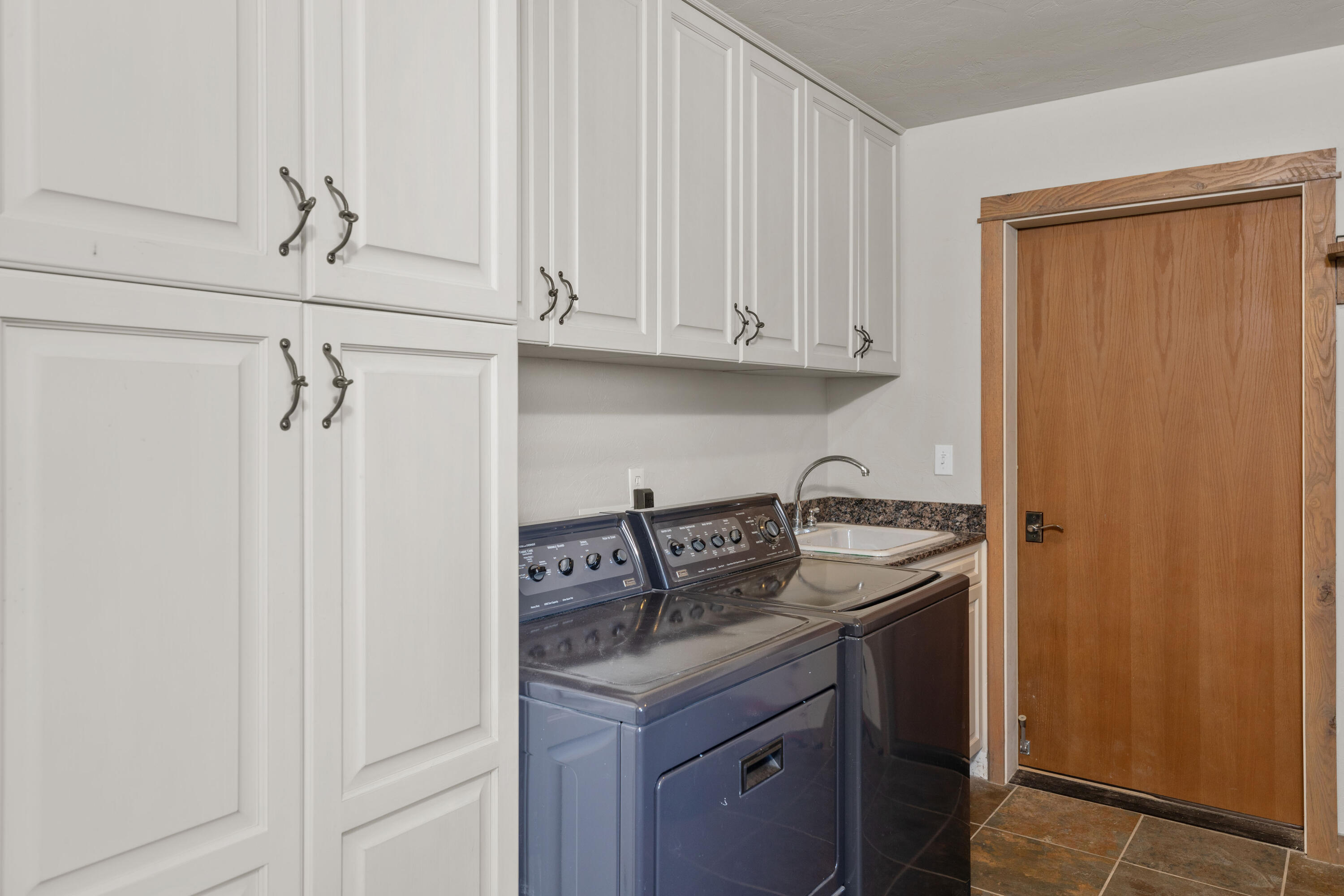 541 Elam Ridge Drive Placerville, CO 81430 - Photo 25 of 36 a view of a kitchen with sink and cabinets