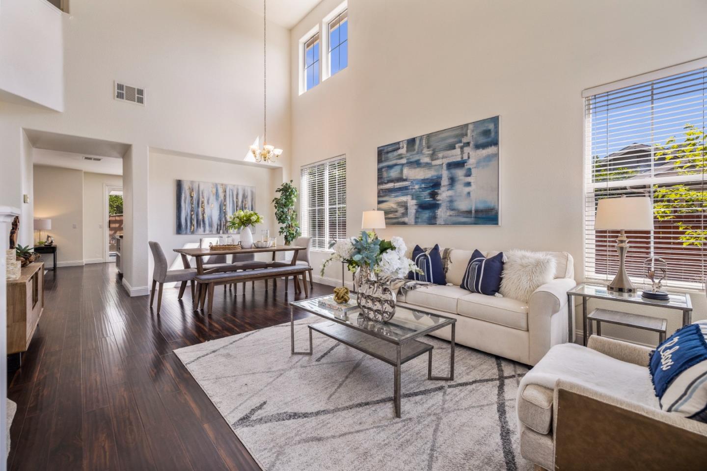 8981 Del Rio Circle Gilroy, CA 95020 - Photo 1 of 35 a living room with furniture wooden floor and a large window