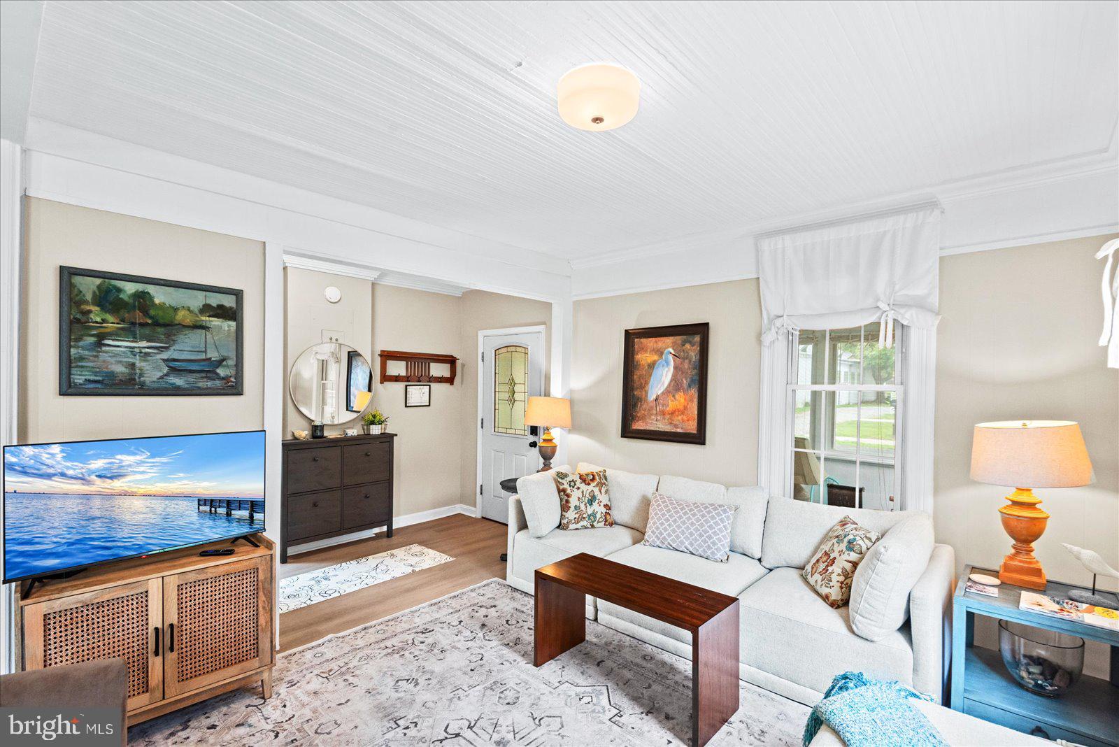 209 Hawthorn Street Colonial Beach, VA 22443 - Photo 12 of 56 a living room with furniture and a window
