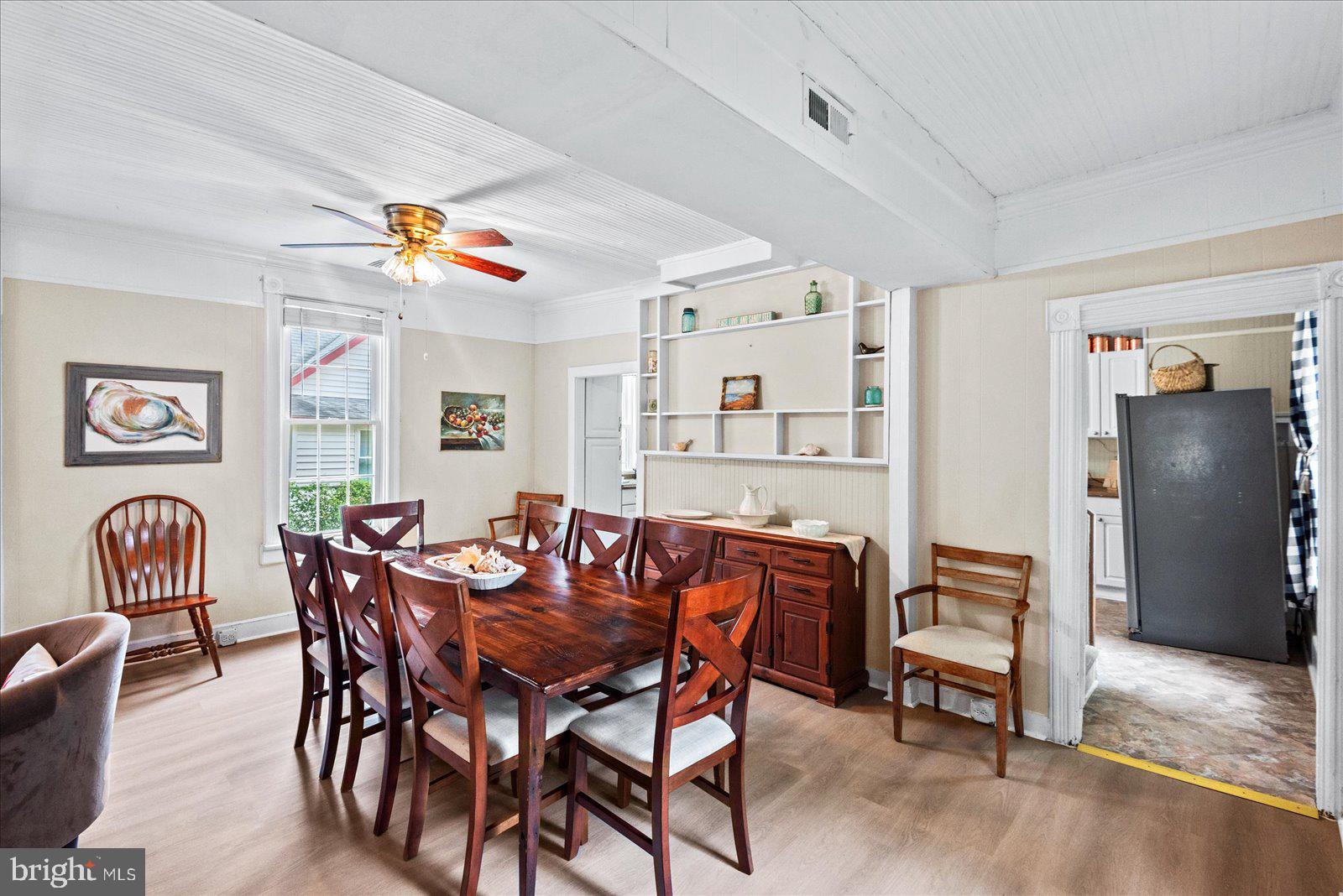 209 Hawthorn Street Colonial Beach, VA 22443 - Photo 13 of 56 a view of a dining room with furniture and chandelier