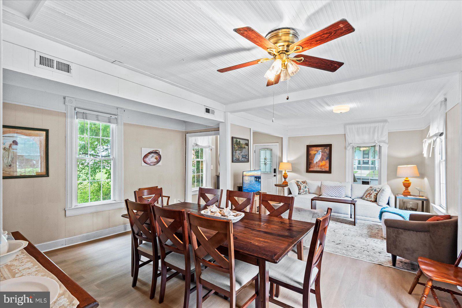 209 Hawthorn Street Colonial Beach, VA 22443 - Photo 14 of 56 a view of a dining room with furniture and a large window