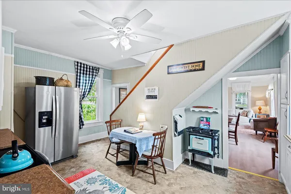 a kitchen with cabinets appliances a sink and a window
