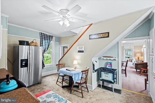 a kitchen with cabinets appliances a sink and a window