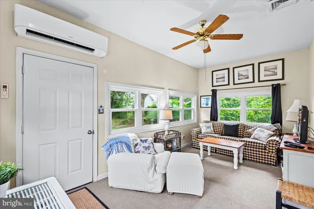 a living room with furniture and a window