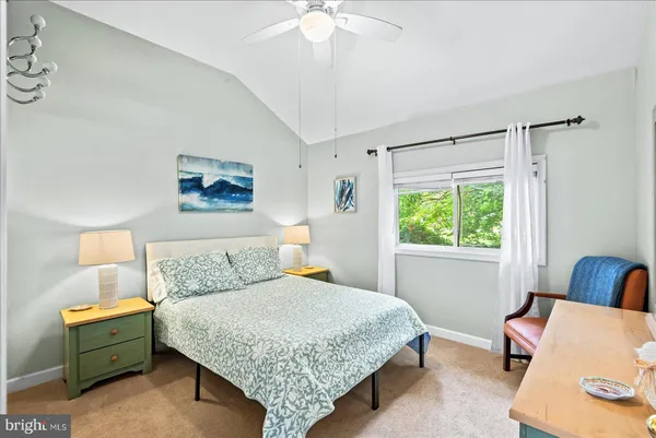 a bedroom with a bed a dresser and a dresser