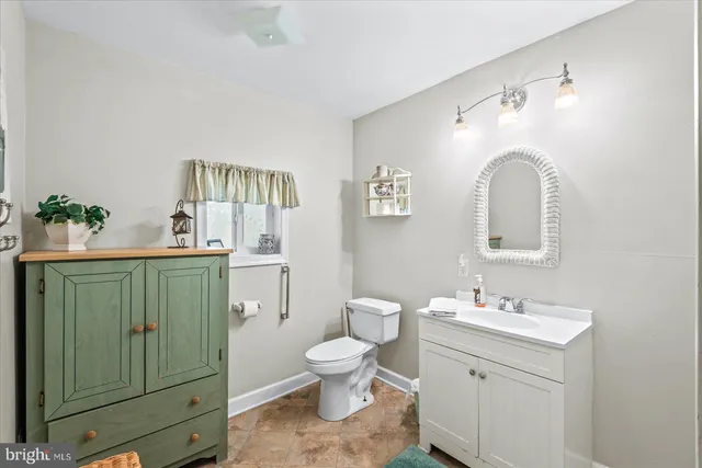 a bathroom with a sink a mirror and a shower