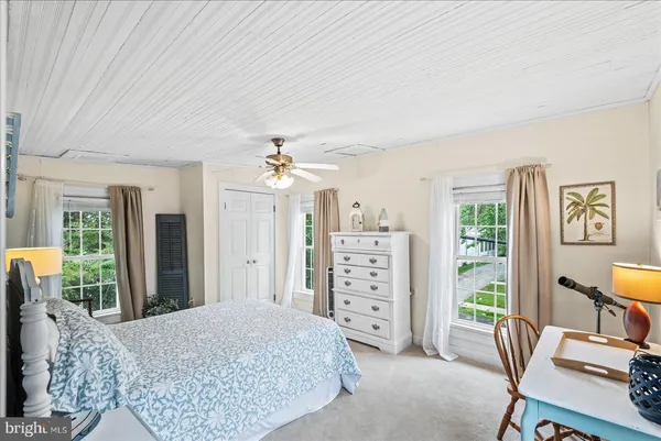 a bedroom with a bed furniture and window