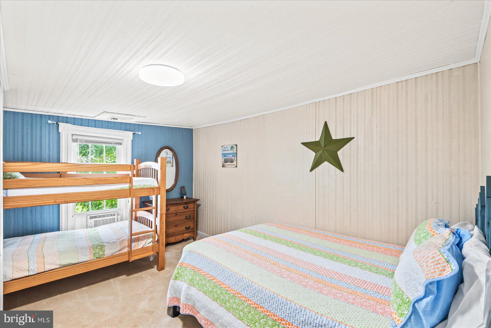 209 Hawthorn Street Colonial Beach, VA 22443 - Photo 29 of 56 a bedroom with a bed and a dresser