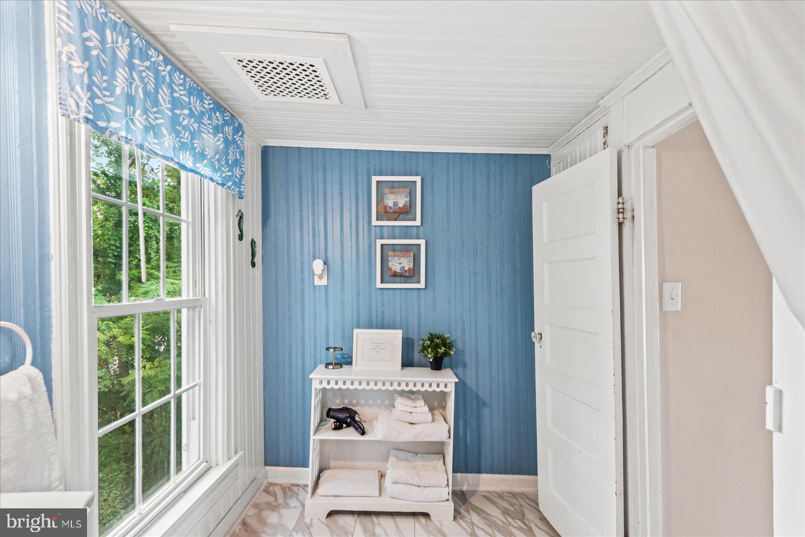 209 Hawthorn Street Colonial Beach, VA 22443 - Photo 35 of 56 a living room with furniture and a window