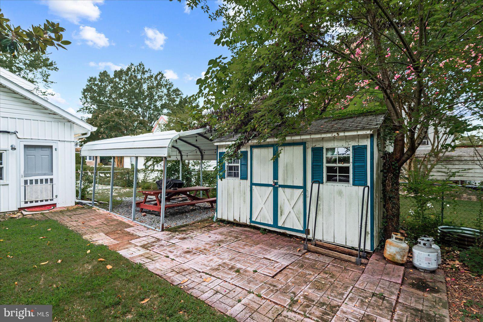 209 Hawthorn Street Colonial Beach, VA 22443 - Photo 39 of 56 a view of a house with backyard and sitting area