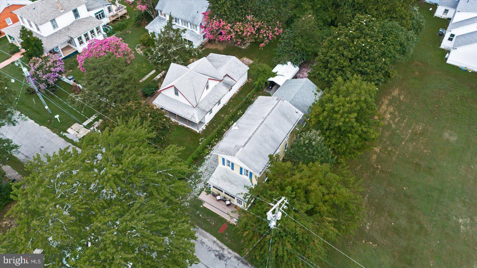 209 Hawthorn Street Colonial Beach, VA 22443 - Photo 43 of 56 a view of a house with a flower garden