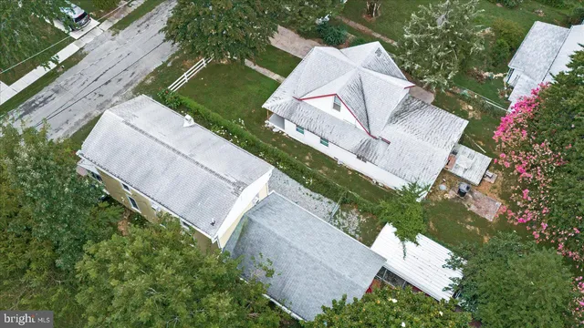an aerial view of a house with outdoor space