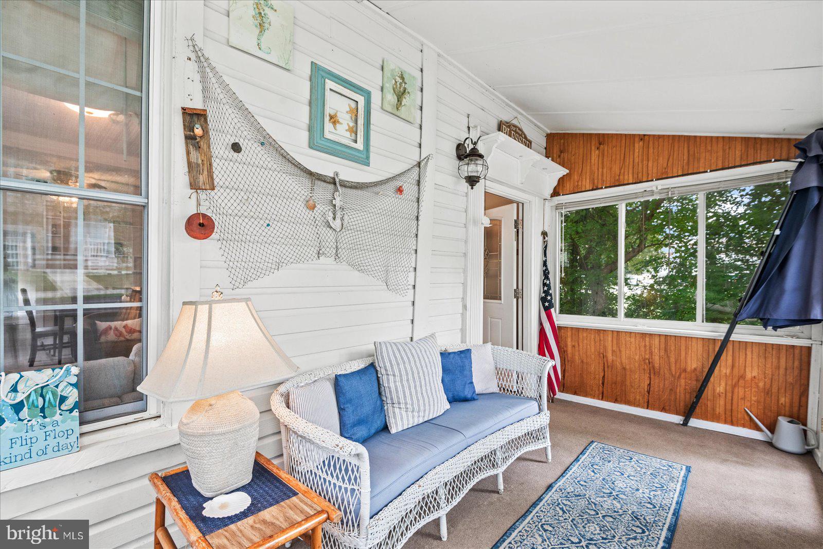 209 Hawthorn Street Colonial Beach, VA 22443 - Photo 8 of 56 a living room with furniture and a large window