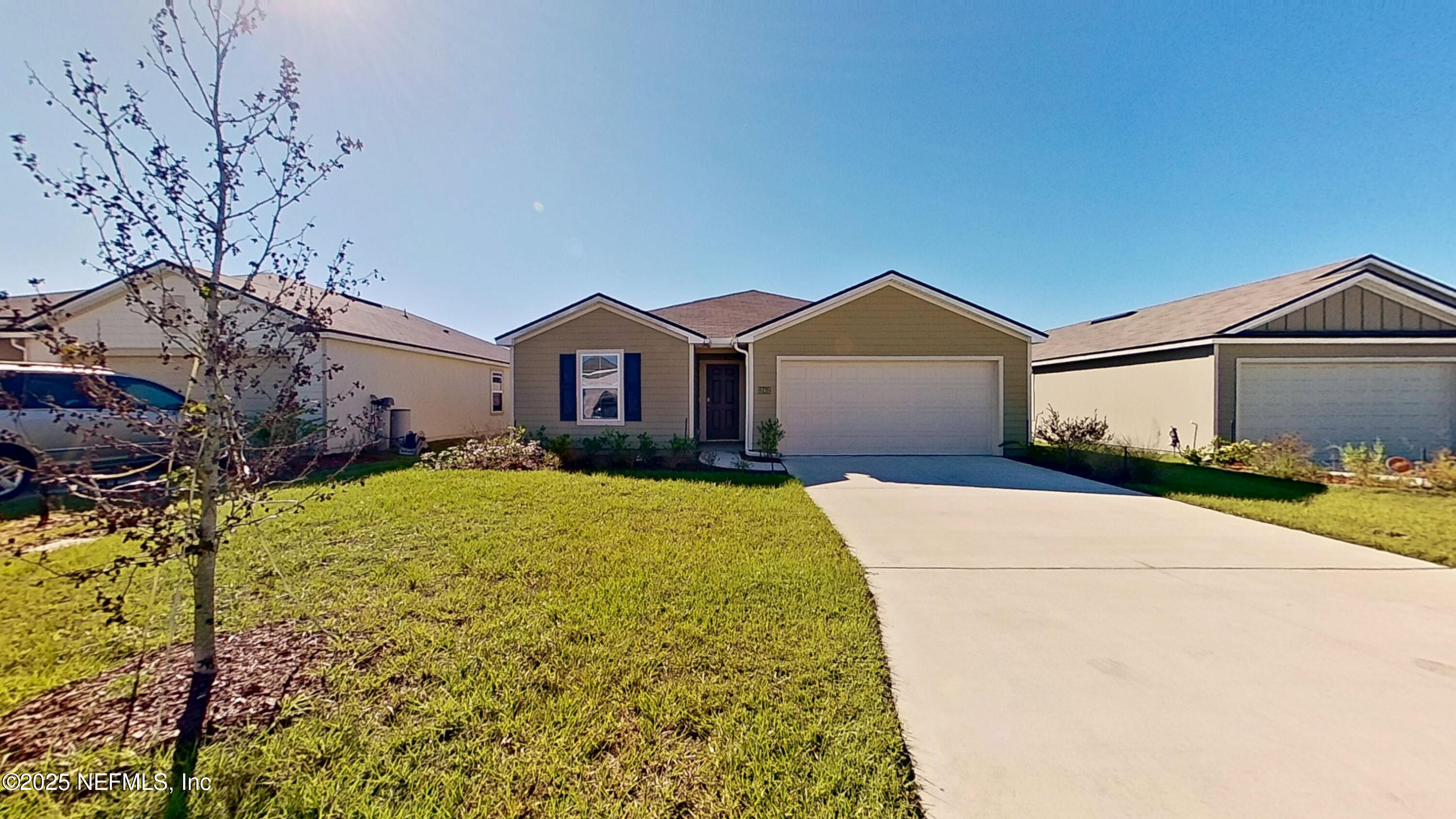 12452 Rubber Fig Terrace Jacksonville, FL 32218 - Photo 2 of 25 a view of outdoor space yard and garage