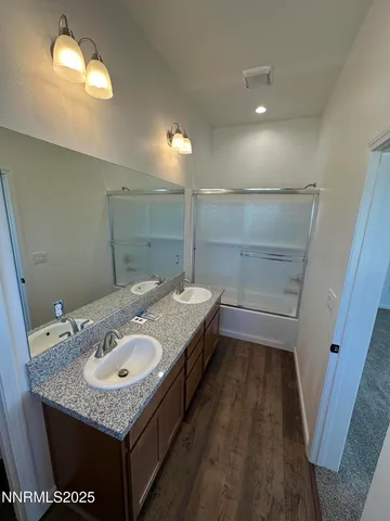 a bathroom with a sink a vanity and mirror