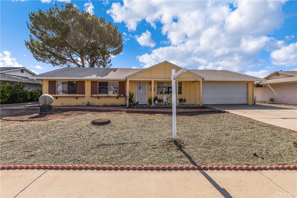 28750 Carmel Road Menifee, CA 92586 - Photo 1 of 1 a front view of a house with garden