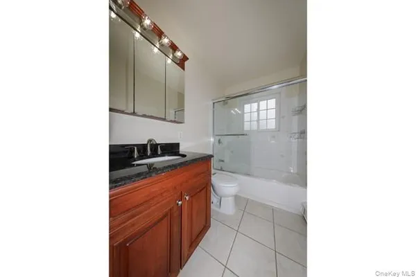 a bathroom with a bathtub and a sink