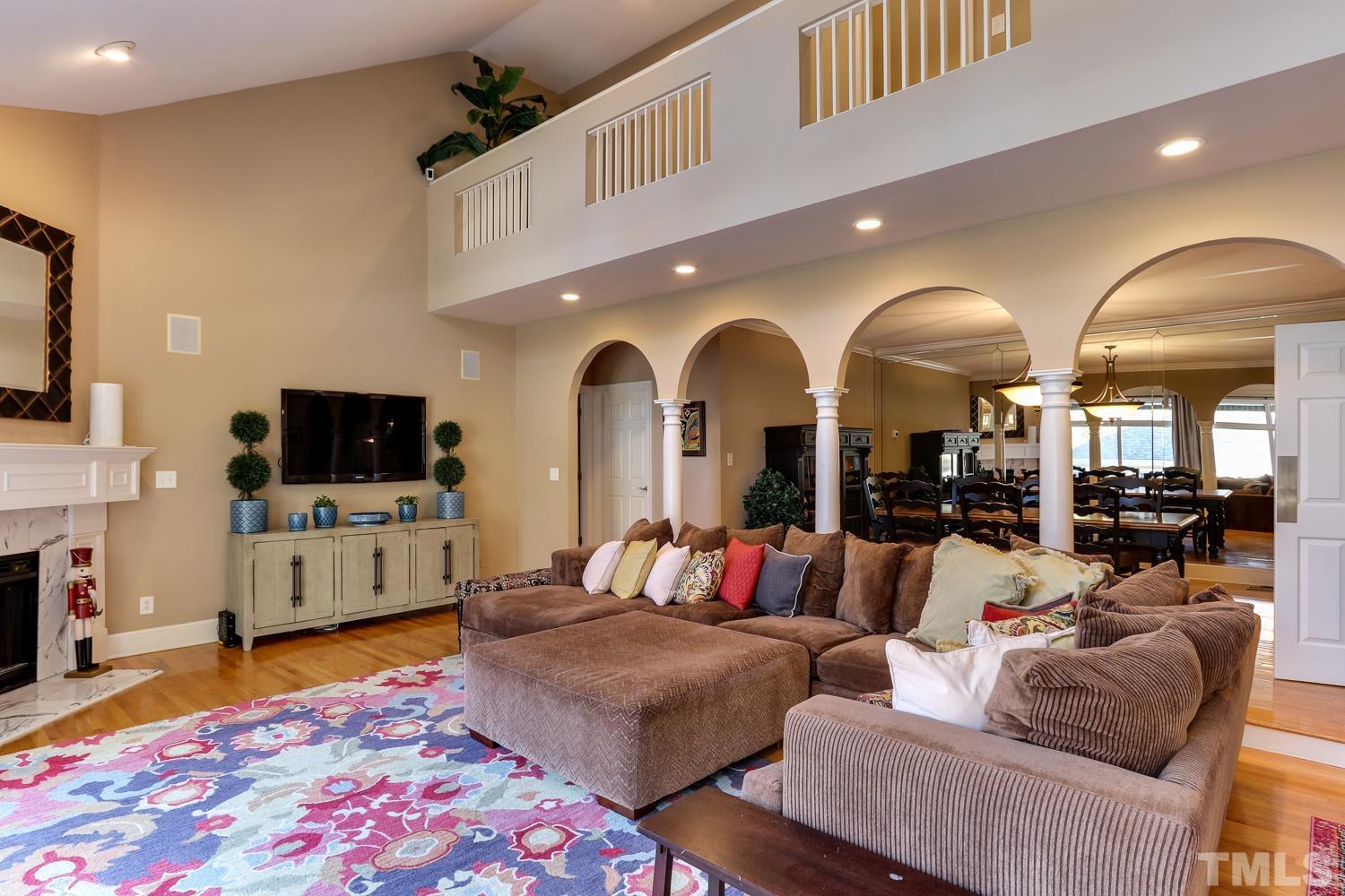 6921 Valley Ridge Court Raleigh, NC 27615 - Photo 3 of 27 a living room with furniture and a flat screen tv