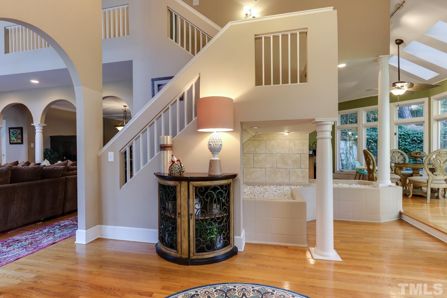 6921 Valley Ridge Court Raleigh, NC 27615 - Photo 8 of 27 a view of entryway and hall with wooden floor