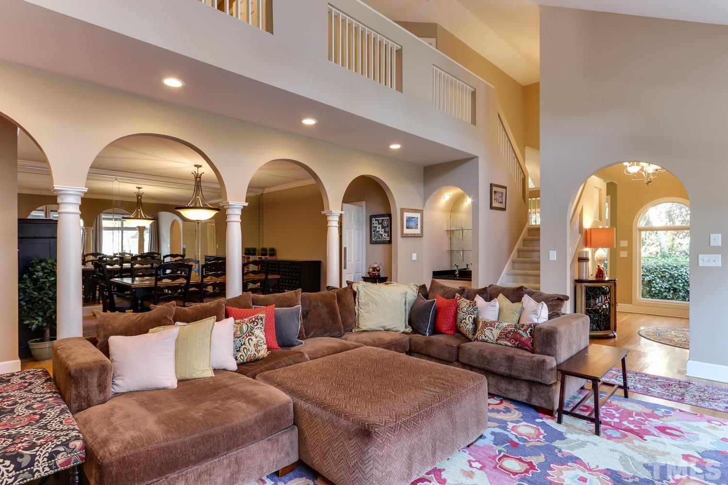 6921 Valley Ridge Court Raleigh, NC 27615 - Photo 10 of 27 a living room with fireplace furniture and a rug