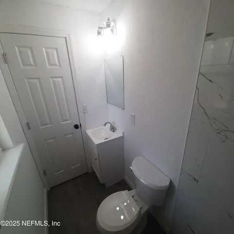 a bathroom with a toilet and a sink
