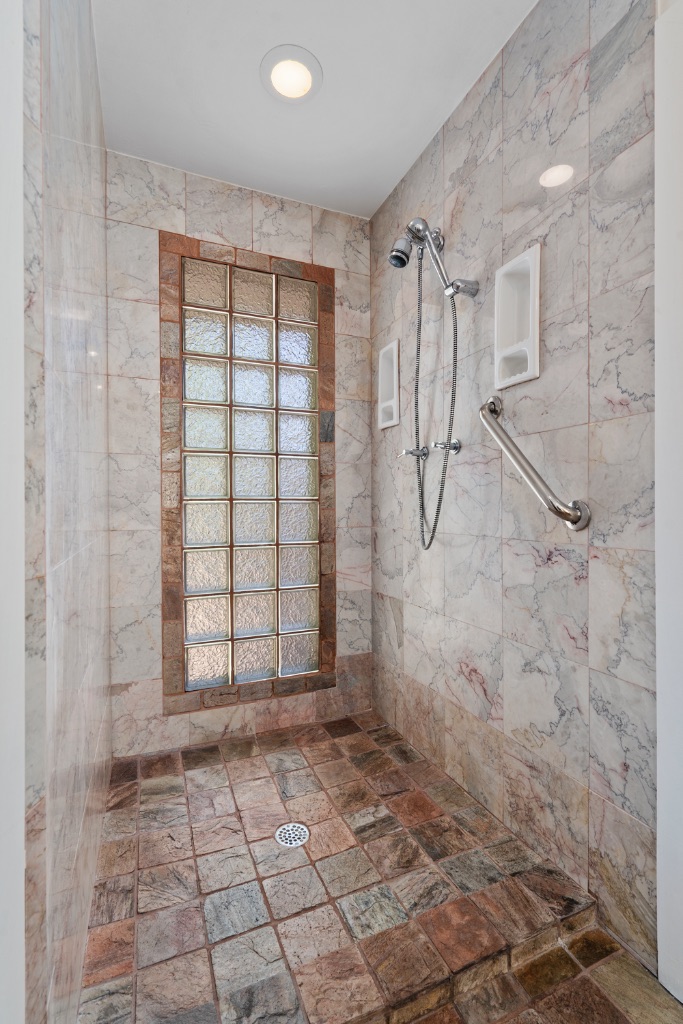 1212 Bentwood Road Austin, TX 78722 - Photo 25 of 32 a bathroom with a shower