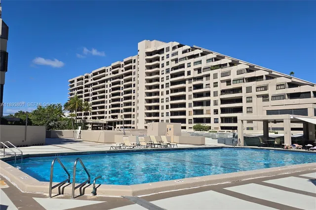 a view of a swimming pool with a lounge chairs