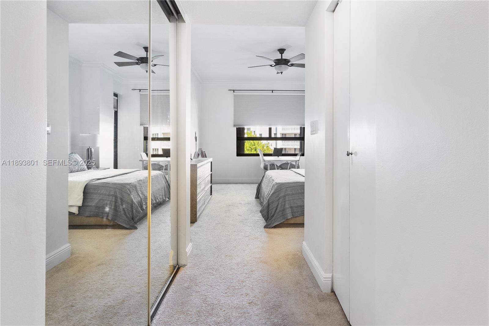 251 Crandon Boulevard, Unit 441 Key Biscayne, FL 33149 - Photo 19 of 28 a bedroom with a bed and a couch