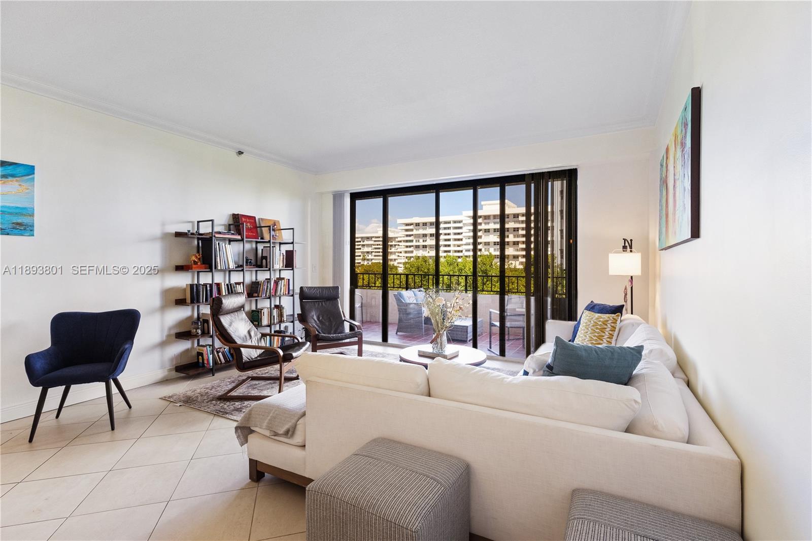 251 Crandon Boulevard, Unit 441 Key Biscayne, FL 33149 - Photo 22 of 28 a living room with furniture and a floor to ceiling window
