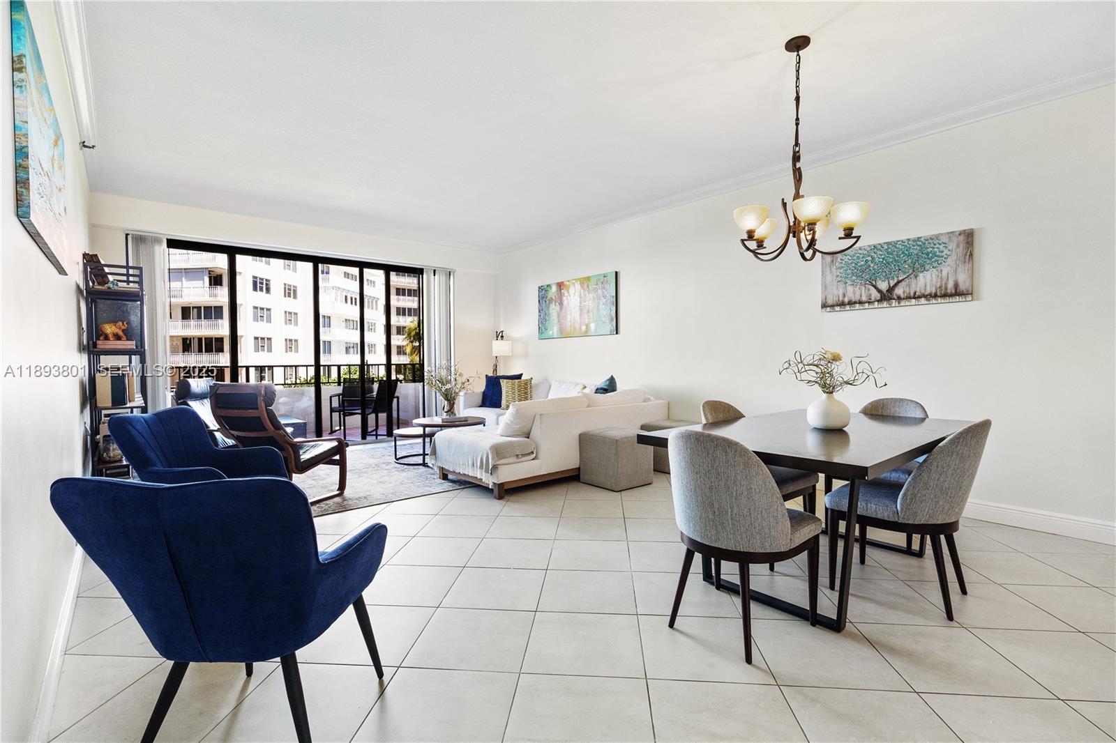 251 Crandon Boulevard, Unit 441 Key Biscayne, FL 33149 - Photo 24 of 28 a living room with furniture and a window