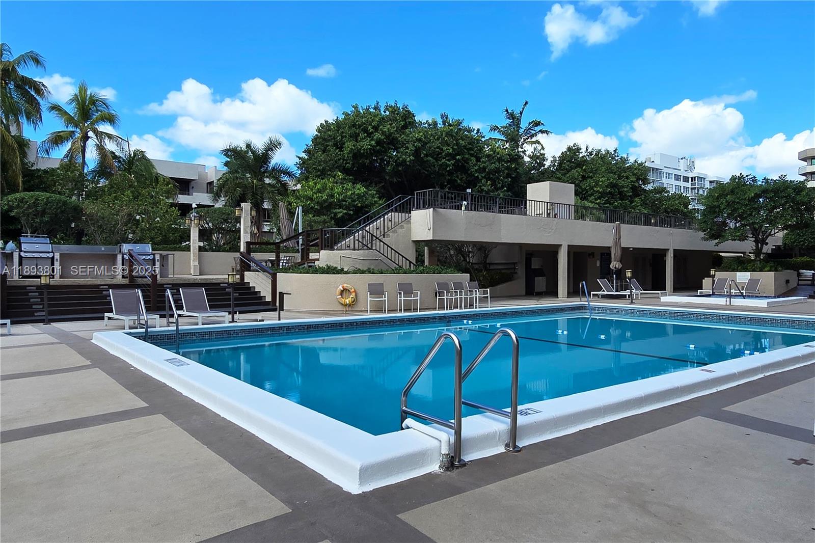 251 Crandon Boulevard, Unit 441 Key Biscayne, FL 33149 - Photo 28 of 28 a view of house with swimming pool and sitting area