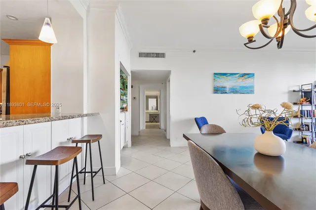 a kitchen with a table and chairs in it