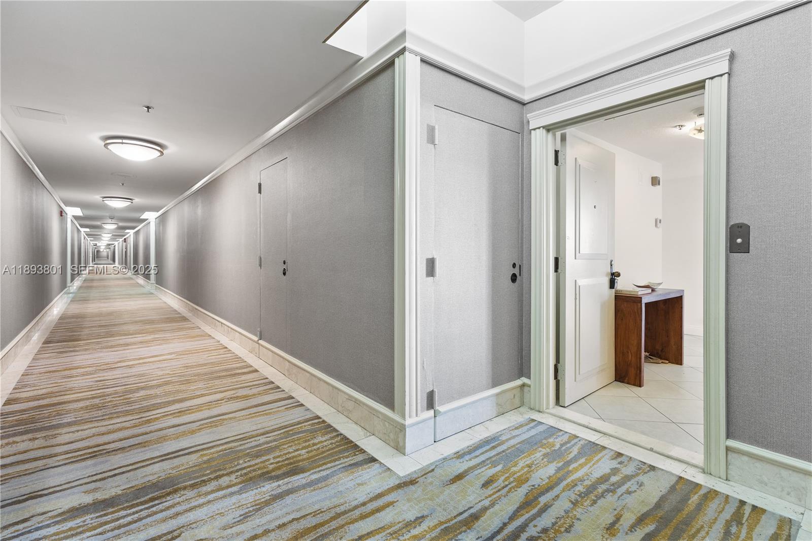 251 Crandon Boulevard, Unit 441 Key Biscayne, FL 33149 - Photo 8 of 28 a view of a hallway with wooden floor
