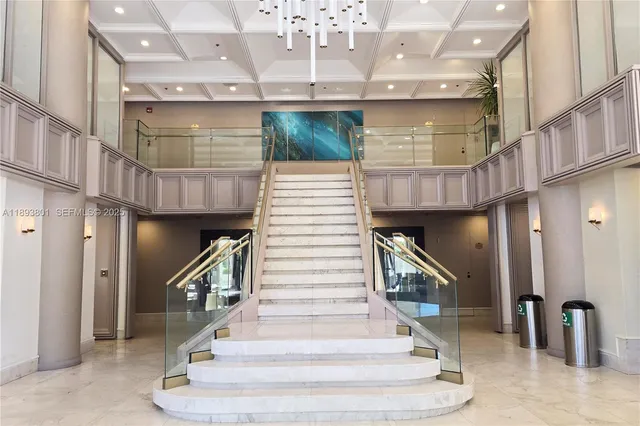 a view of a hallway with entryway and hall