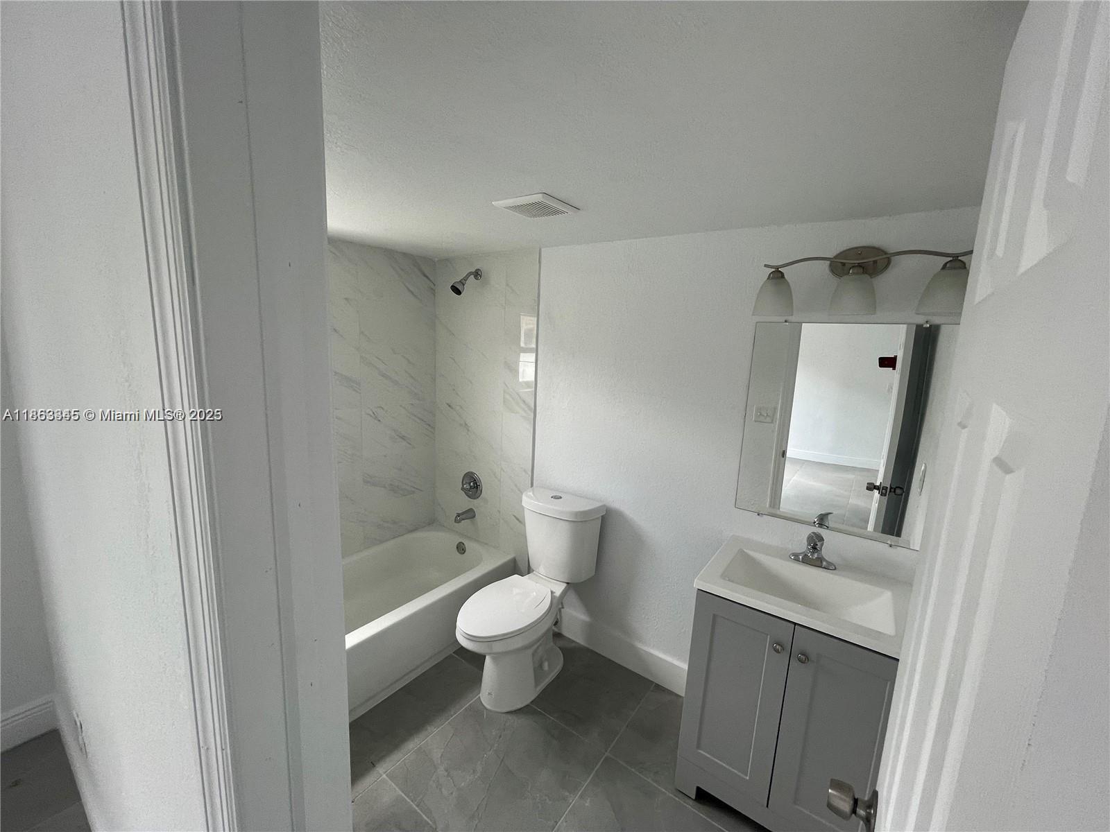 508 East 40th Street Hialeah, FL 33013 - Photo 4 of 8 a bathroom with a sink a toilet and shower