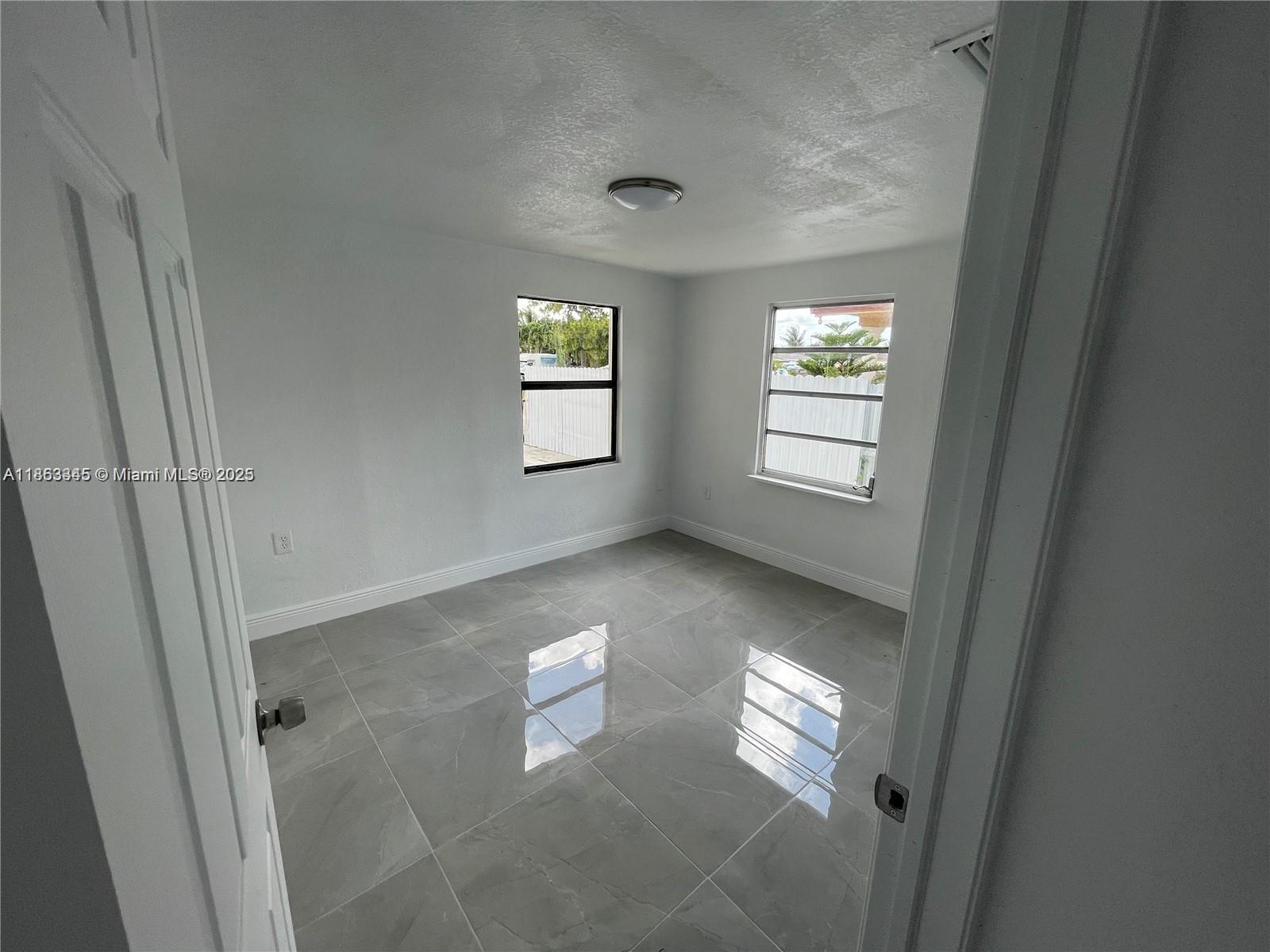 508 East 40th Street Hialeah, FL 33013 - Photo 6 of 8 a view of an empty room and a window