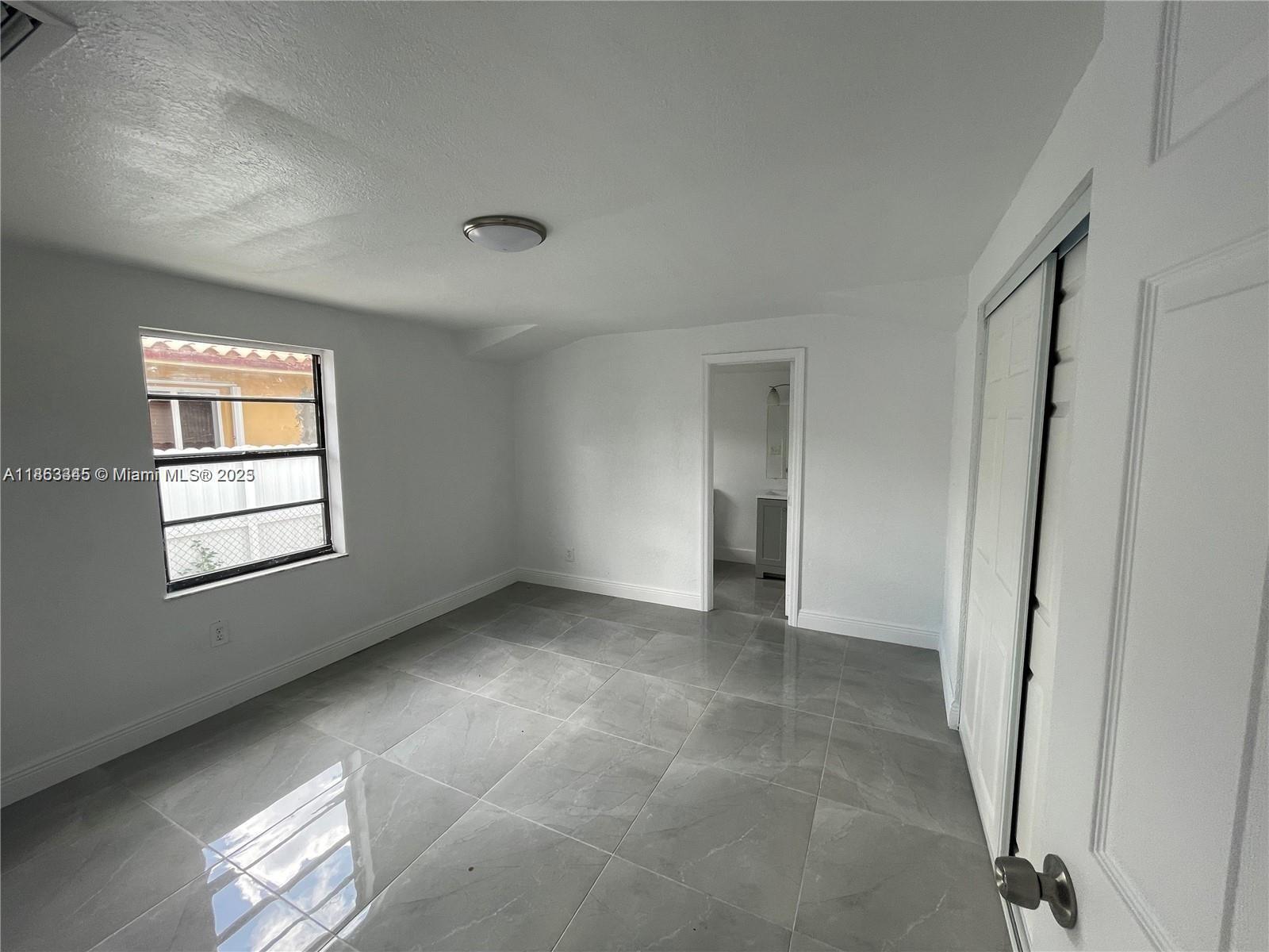 508 East 40th Street Hialeah, FL 33013 - Photo 7 of 8 a view of an empty room with a window