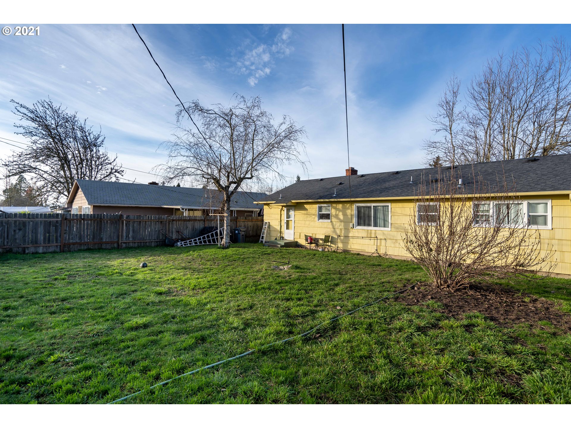 1367 Olympic Street Springfield, OR 97477 - Photo 19 of 20 a view of a house with a backyard