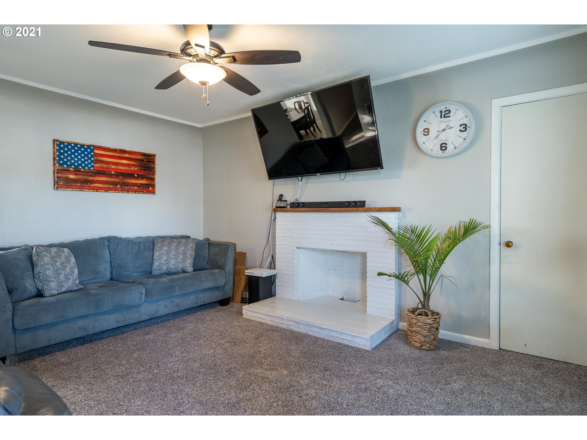 1367 Olympic Street Springfield, OR 97477 - Photo 3 of 20 a living room with furniture and a flat screen tv
