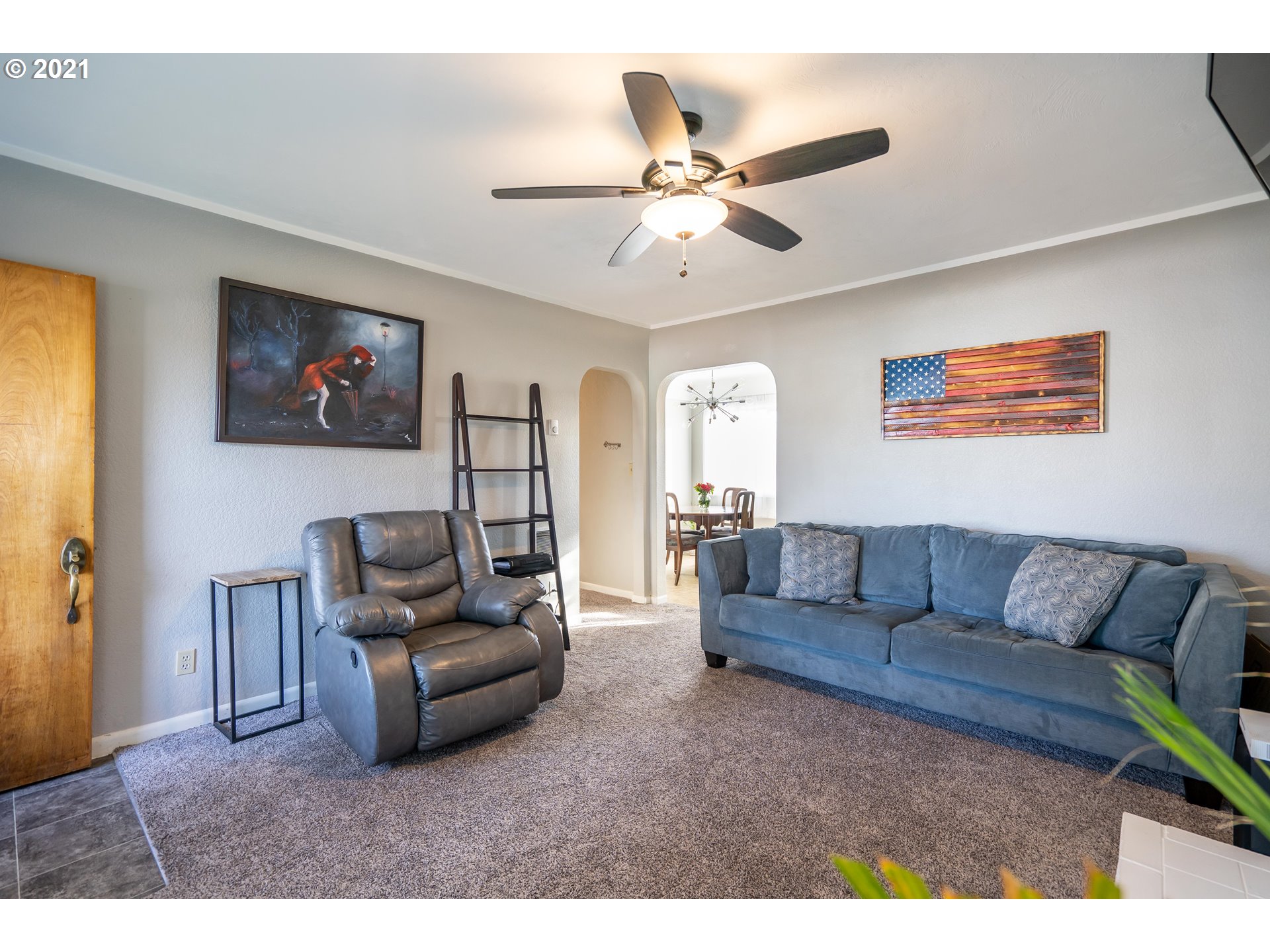 1367 Olympic Street Springfield, OR 97477 - Photo 4 of 20 a living room with furniture and a flat screen tv